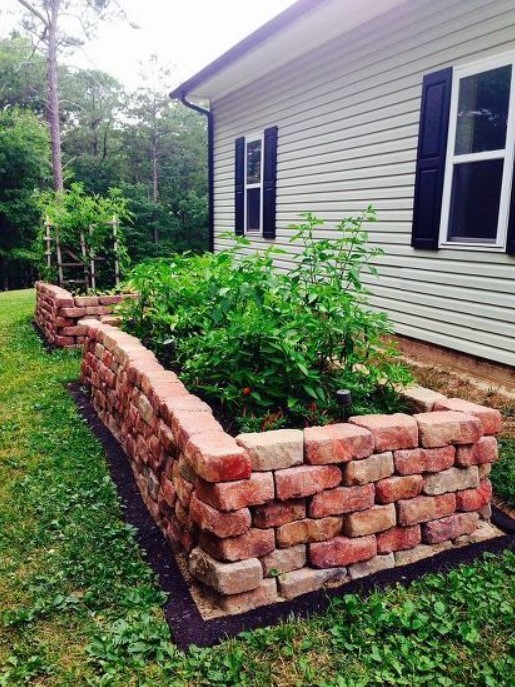 Stacked Brick Planter next to house